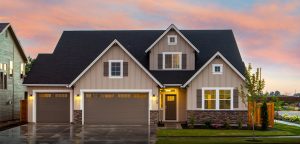 modern two-story home features a three-car garage